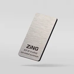 Prostokątny metalowy obiekt z napisem Zing.